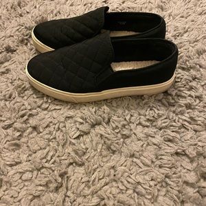 Black and white Aldo slip on sneakers